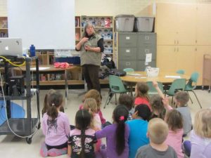 Jan delivering a wildlife presentation to a classroom of students